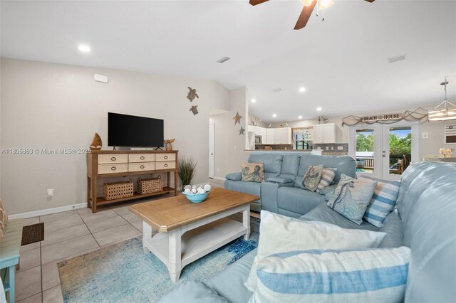 7434 Ashtabula St, Englewood, FL 34224 - living room with ceiling fan, vaulted ceiling, french doors, baseboards, and recessed lighting