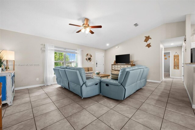 7434 Ashtabula St, Englewood, FL 34224 - living room with vaulted ceiling, a ceiling fan, light tile patterned flooring, and baseboards