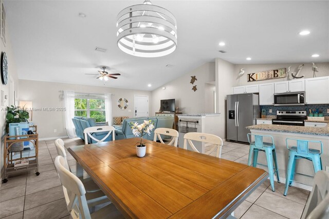 7434 Ashtabula St, Englewood, FL 34224 - dining room featuring light tile patterned floors, lofted ceiling, recessed lighting, ceiling fan, and baseboards