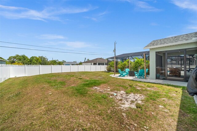 7434 Ashtabula St, Englewood, FL 34224 - view of yard featuring a sunroom and a patio area