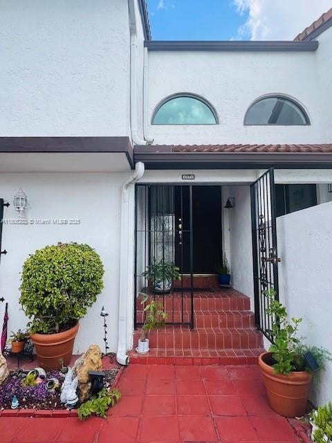 1271 SW 124th Ct Unit 2-D, Miami, FL 33184 - doorway to property with stucco siding