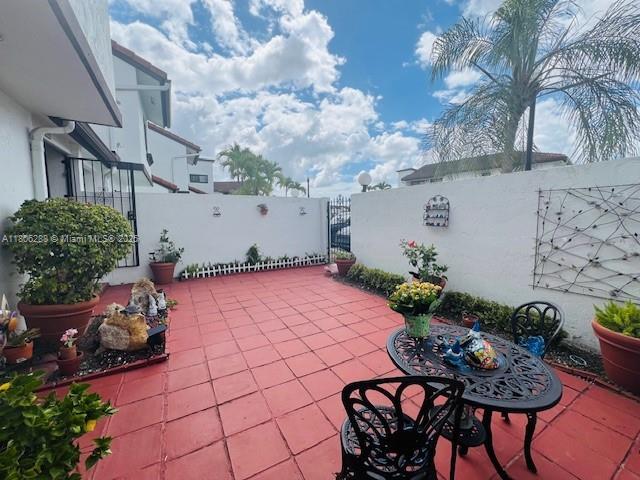 1271 SW 124th Ct Unit 2-D, Miami, FL 33184 - view of patio featuring a gate