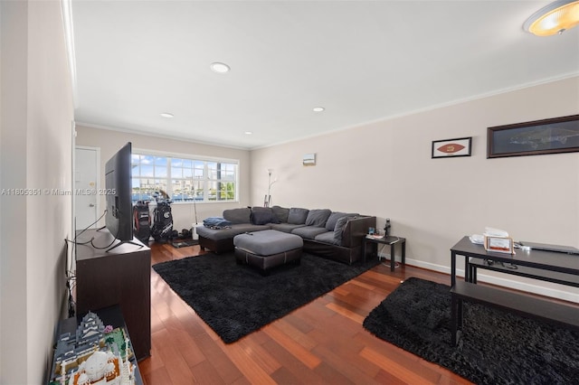 462 Golden Isles Dr Unit 305, Hallandale Beach, FL 33009 - living room featuring crown molding, wood finished floors, and baseboards