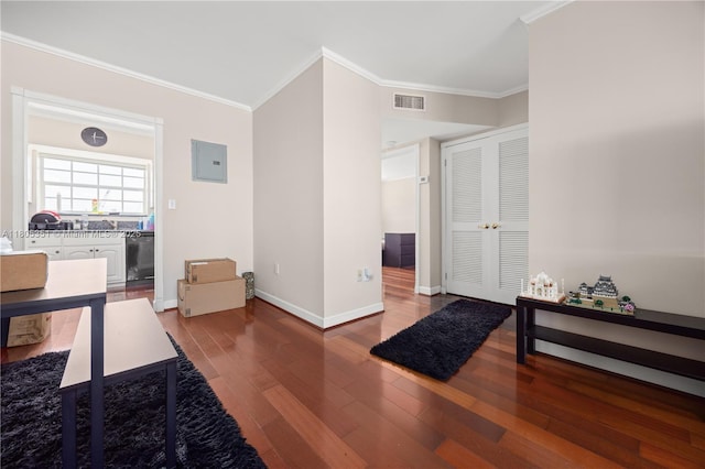 462 Golden Isles Dr Unit 305, Hallandale Beach, FL 33009 - entryway with ornamental molding, wood finished floors, baseboards, and electric panel