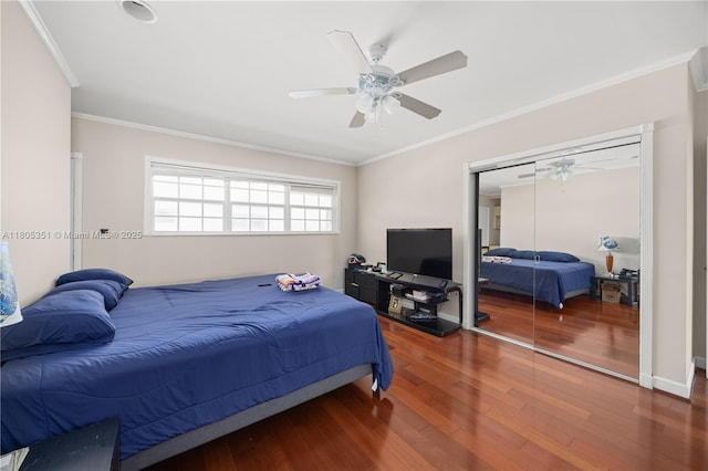 462 Golden Isles Dr Unit 305, Hallandale Beach, FL 33009 - bedroom featuring wood finished floors, crown molding, a ceiling fan, and a closet
