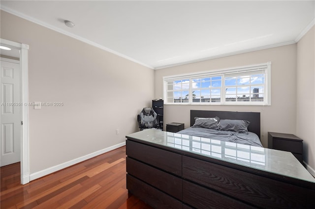 462 Golden Isles Dr Unit 305, Hallandale Beach, FL 33009 - bedroom with ornamental molding, wood finished floors, and baseboards