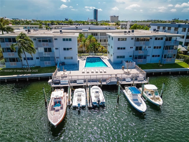 462 Golden Isles Dr Unit 305, Hallandale Beach, FL 33009 - dock with a water view, a patio, and boat lift