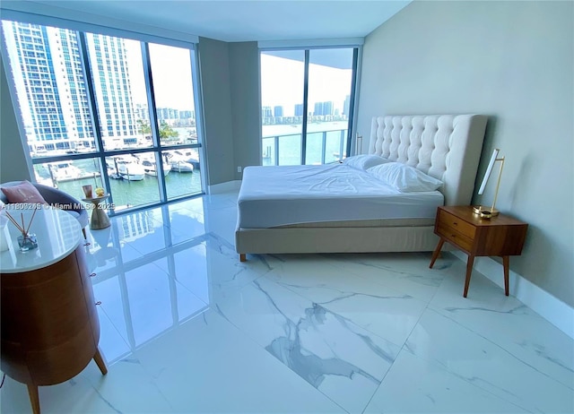 17111 Biscayne Blvd Unit 403, North Miami Beach, FL 33160 - bedroom with baseboards, a city view, marble finish floors, a water view, and expansive windows