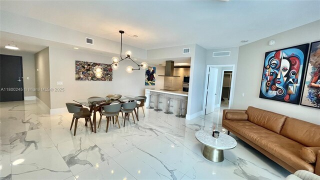 17111 Biscayne Blvd Unit 403, North Miami Beach, FL 33160 - living room with light marble finish floors and a chandelier
