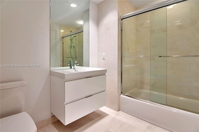 17111 Biscayne Blvd Unit 403, North Miami Beach, FL 33160 - bathroom featuring toilet, shower / bath combination with glass door, vanity, and tile patterned floors