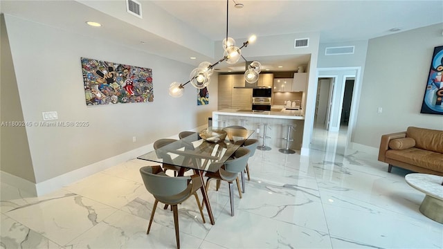 17111 Biscayne Blvd Unit 403, North Miami Beach, FL 33160 - dining room with light marble finish flooring and recessed lighting