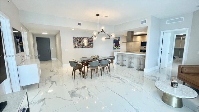 17111 Biscayne Blvd Unit 403, North Miami Beach, FL 33160 - dining room featuring a chandelier and light marble finish flooring