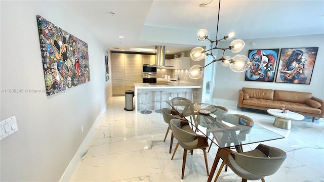 17111 Biscayne Blvd Unit 403, North Miami Beach, FL 33160 - dining area featuring light marble finish floors, a chandelier, and recessed lighting