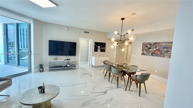 17111 Biscayne Blvd Unit 403, North Miami Beach, FL 33160 - dining area featuring marble finish flooring, a chandelier, and plenty of natural light
