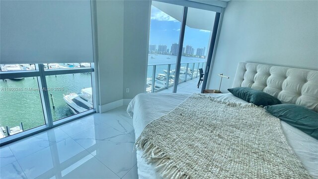 17111 Biscayne Blvd Unit 403, North Miami Beach, FL 33160 - bedroom with multiple windows, access to outside, a water view, and a view of city