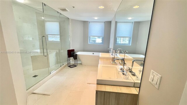 17111 Biscayne Blvd Unit 403, North Miami Beach, FL 33160 - full bathroom featuring a shower stall, a soaking tub, double vanity, and recessed lighting