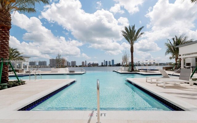 17111 Biscayne Blvd Unit 403, North Miami Beach, FL 33160 - community pool featuring a patio and a view of skyline