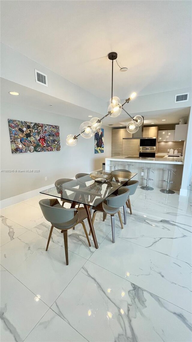 17111 Biscayne Blvd Unit 403, North Miami Beach, FL 33160 - dining area with marble finish flooring and baseboards
