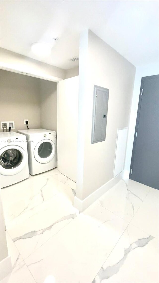 17111 Biscayne Blvd Unit 403, North Miami Beach, FL 33160 - laundry room with marble finish flooring, electric panel, and washer and dryer