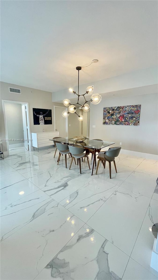 17111 Biscayne Blvd Unit 403, North Miami Beach, FL 33160 - dining area featuring marble finish floors and a chandelier