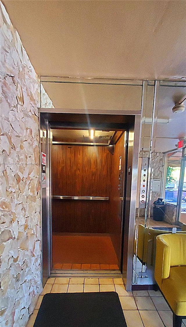 3905 N Nob Hill Rd Unit 510, Sunrise, FL 33351 - elevator with a textured ceiling