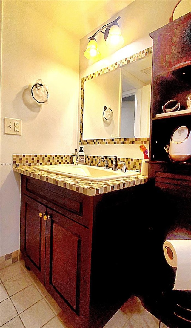 3905 N Nob Hill Rd Unit 510, Sunrise, FL 33351 - bathroom with decorative backsplash, vanity, tile patterned floors, and baseboards