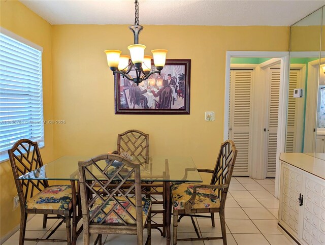 1280 NW 43rd Ave Unit 205, Lauderhill, FL 33313 - dining room featuring a chandelier and light tile patterned flooring