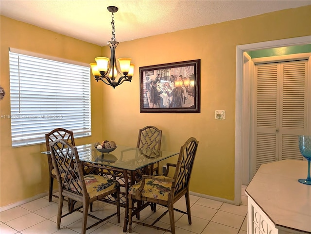 1280 NW 43rd Ave Unit 205, Lauderhill, FL 33313 - dining room with a chandelier, light tile patterned floors, and baseboards