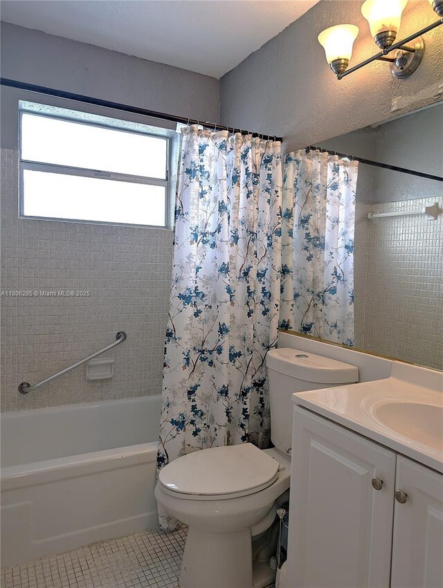 1280 NW 43rd Ave Unit 205, Lauderhill, FL 33313 - bathroom featuring tile patterned floors, toilet, shower / bath combo with shower curtain, and vanity