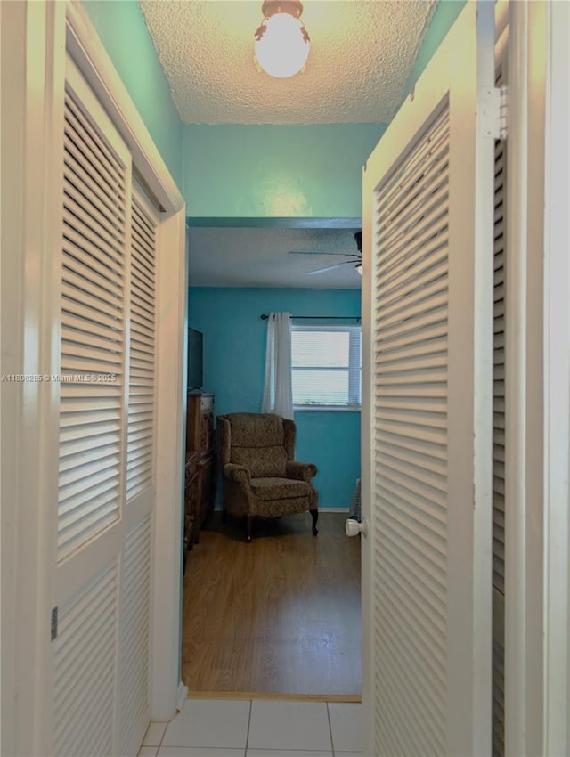 1280 NW 43rd Ave Unit 205, Lauderhill, FL 33313 - hallway featuring a textured ceiling and tile patterned flooring