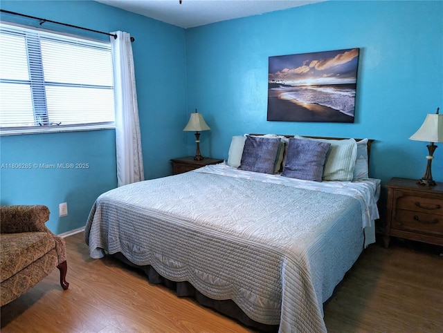 1280 NW 43rd Ave Unit 205, Lauderhill, FL 33313 - bedroom with wood finished floors and baseboards