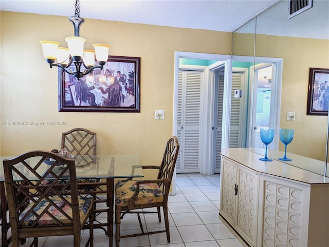 1280 NW 43rd Ave Unit 205, Lauderhill, FL 33313 - dining space featuring a chandelier and light tile patterned flooring