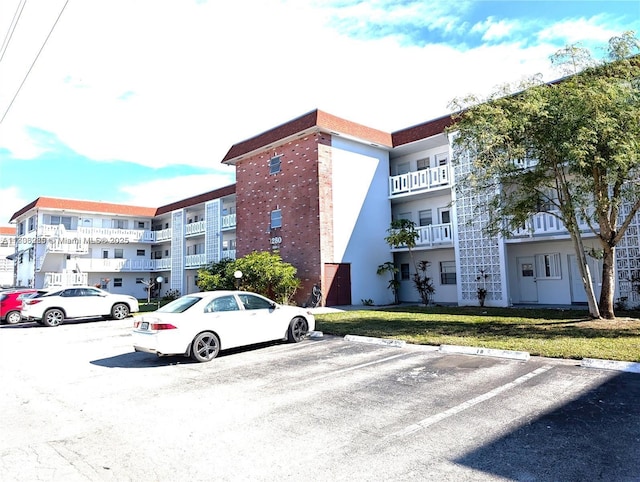1280 NW 43rd Ave Unit 205, Lauderhill, FL 33313 - view of apartment building / complex with uncovered parking