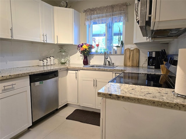 6626 SW 1st Ct, Pembroke Pines, FL 33023 - kitchen with appliances with stainless steel finishes, a sink, white cabinetry, and backsplash