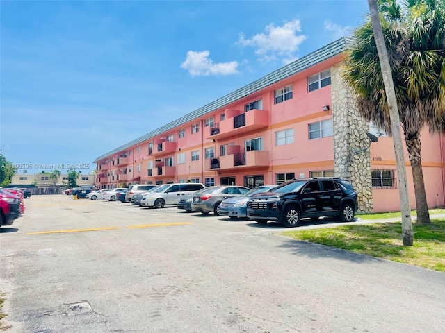 17101 NW 57th Ave Unit 314, Miami Gardens, FL 33055 - view of property featuring uncovered parking