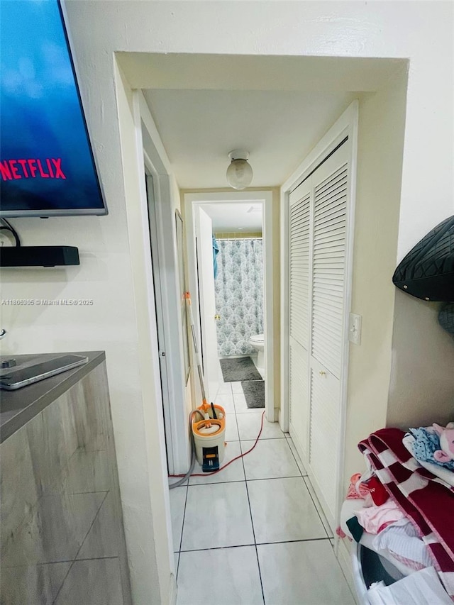 17101 NW 57th Ave Unit 314, Miami Gardens, FL 33055 - hallway with light tile patterned flooring