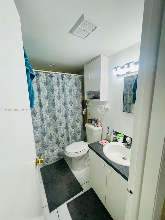 17101 NW 57th Ave Unit 314, Miami Gardens, FL 33055 - full bathroom featuring vanity, tile patterned flooring, toilet, and curtained shower