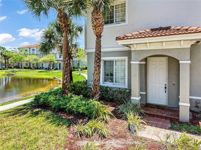 2801 SW 81st Ter, Miramar, FL 33025 - property entrance featuring stucco siding, a water view, and a tile roof