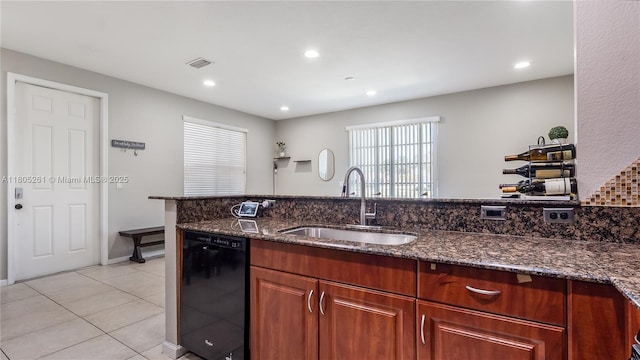 2801 SW 81st Ter, Miramar, FL 33025 - kitchen with black dishwasher, a sink, dark stone counters, light tile patterned floors, and recessed lighting