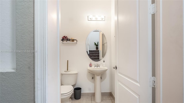 2801 SW 81st Ter, Miramar, FL 33025 - half bathroom featuring tile patterned floors, toilet, and baseboards