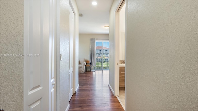 2801 SW 81st Ter, Miramar, FL 33025 - hallway featuring dark wood-style flooring, a textured wall, and baseboards
