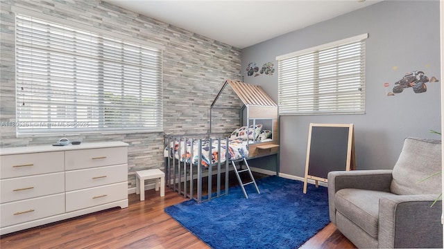2801 SW 81st Ter, Miramar, FL 33025 - bedroom with multiple windows, tile walls, and wood finished floors
