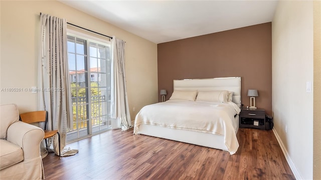 2801 SW 81st Ter, Miramar, FL 33025 - bedroom with wood finished floors, access to outside, and baseboards