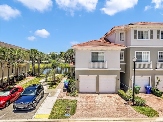 2801 SW 81st Ter, Miramar, FL 33025 - mediterranean / spanish-style house with a tile roof, a garage, stucco siding, and a water view