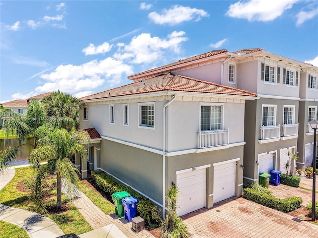 2801 SW 81st Ter, Miramar, FL 33025 - view of front of house with a garage, a tile roof, decorative driveway, and stucco siding