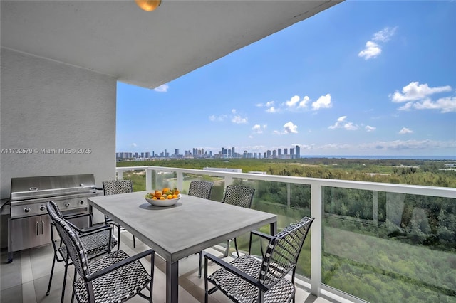 14951 Royal Oaks Ln Unit 2105, North Miami, FL 33181 - balcony featuring a skyline view, a grill, and outdoor dining space