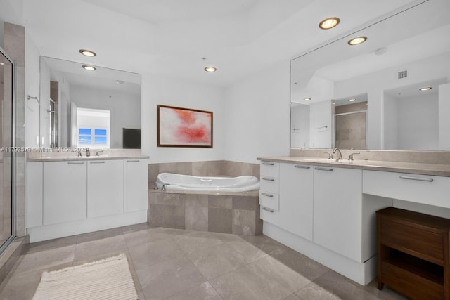 14951 Royal Oaks Ln Unit 2105, North Miami, FL 33181 - full bathroom featuring a stall shower, a garden tub, two vanities, recessed lighting, and tile patterned floors