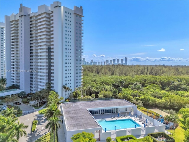 14951 Royal Oaks Ln Unit 2105, North Miami, FL 33181 - bird's eye view of a pool area and a forest