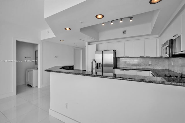 14951 Royal Oaks Ln Unit 2105, North Miami, FL 33181 - kitchen featuring stainless steel appliances, dark stone countertops, white cabinetry, backsplash, and recessed lighting
