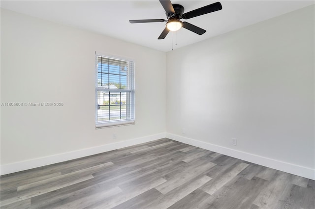 143 Greentree Cir, Jupiter, FL 33458 - spare room with wood finished floors, baseboards, and a ceiling fan